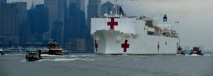 Coast Guard assets, along with New York Police Department and New York Fire Department assets, provide a security escort for the USNS Comfort arrival into New York Harbor, March 30, 2020